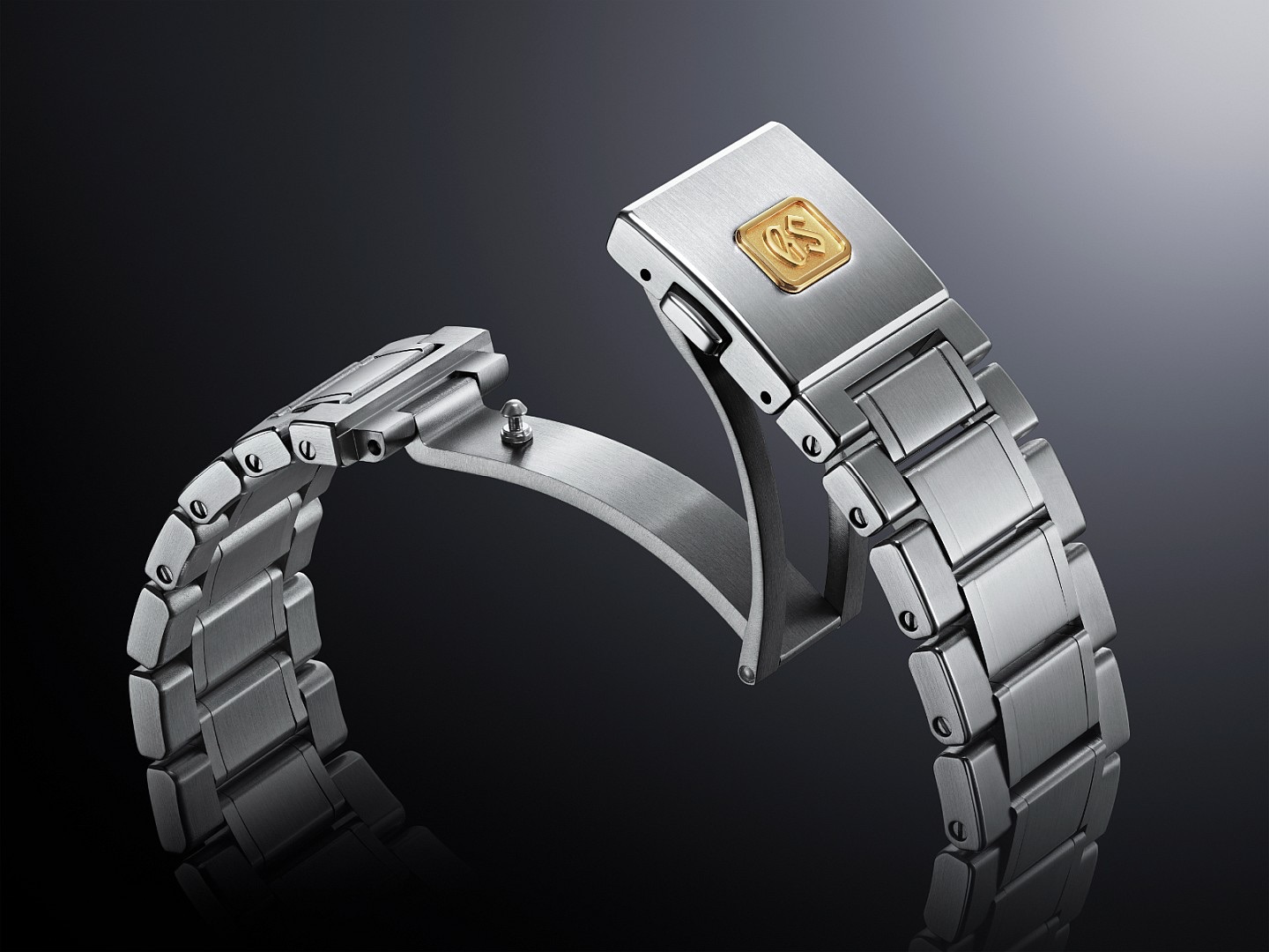 Grand Seiko 严美溪谷高振频机械腕表SLGH021的面盘采用全新模压立体纹路，映照着浅绿翡翠色调，有如严美溪谷清澈见底的蓝绿色水面。